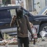 An armed member of the G9 and Family gang patrols a roadblock in the Delmas 6 neighbourhood of Port-au-Prince, Haiti, on Monday.