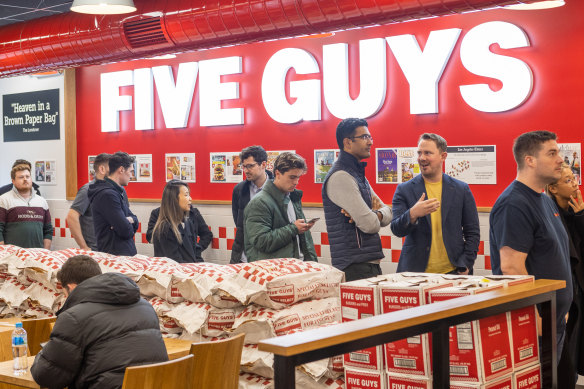 Customers queue at Five Guys in Melbourne.