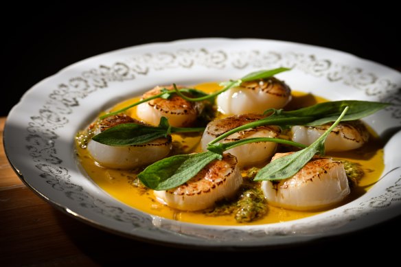 Abrolhos Islands scallops with roast garlic, chilli and coriander butter, lemon and sheep sorrel.