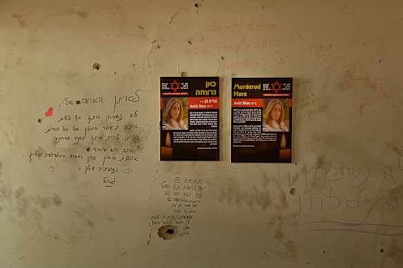 Tributes are written on the wall around a poster dedicated to paramedic Amit Man, 22, who was murdered by Hamas while treating casualties during the October 7 attack in Kibbutz Be’eri.