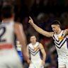 Patrick Voss of the Dockers celebrates kicking a goal.