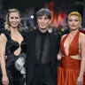 Emily Blunt (right), Cillian Murphy (centre) and Florence Pugh (left) at the “Oppenheimer” premiere in London on July 13, 2023. The actors left the event early, in support of the strike.