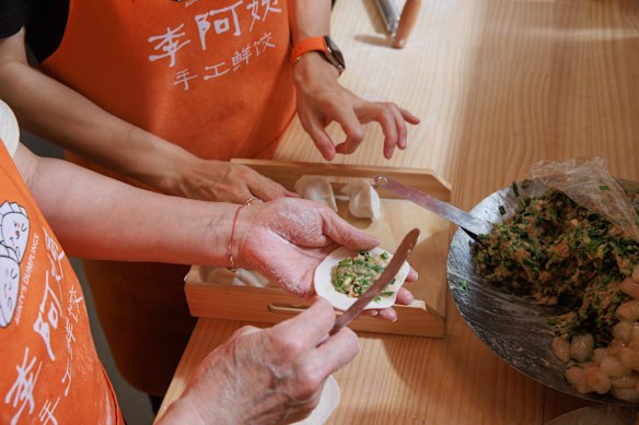 The mother-daughter duo make up to 1600 dumplings a day in the open kitchen.