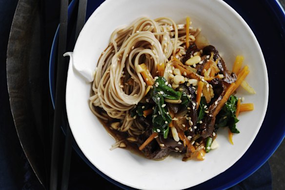 Pine nuts and sesame seeds add crunch to this warm Korean-style beef noodle salad.