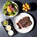 Mains, such as inside skirt steak, come with a salad, Colombian-style sauces – one a lemony sour cream, the other a zesty tomato – and a choice of fries, rice, plantain fritters, cassava chips or golden potatoes (pictured).