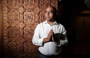 Praful Jethwa, a volunteer at the BAPS Shri Swarminaryan in Rosehill. The swastika is engraved on the front doors. 