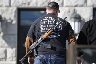 A man carries a weapon during a second amendment gun rally in Salt Lake City in February 2020.