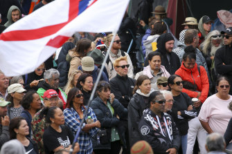 Protesters look on during a protest in Wellington, New Zealand. 