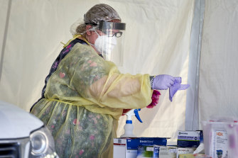 A nurse prepares to administer a coronavirus test in Nebraska this week.