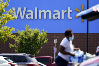 Walmart shares plunged as the retailer said earnings are likely to drop about 1 per cent this year, abandoning its previous forecast for a mid-single-digit gain.