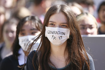 A young protester joins a strike to raise climate change awareness in Wellington, NZ, last year.
