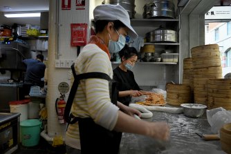Staff at Nanjing Dumpling restaurant prepare food in Sydney’s Chinatown on Friday.