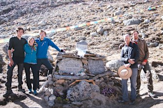 The family at a memorial for Lowe and Bridges at Shishapangma base camp.