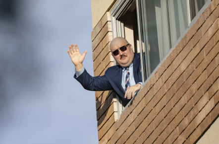 Simeon Boikov waves from the Russian consulate in Sydney, where he has been evading Australian authorities.