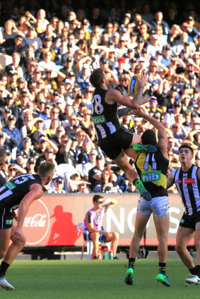 Spectacular: Jeremy Howe flies high for Collingwood.