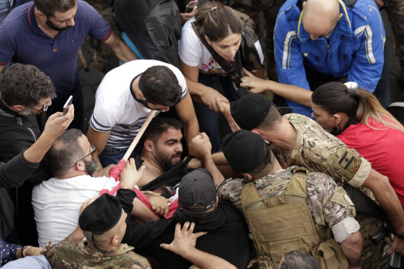 Scuffles break out between protesters and Lebanese army soldiers in Jal al-Dib, north of Beirut, on Wednesday.