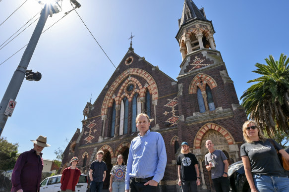 Peter Tregear (centre) and members of the Friends of the Former Wesleyan Church group want the property returned for community use.