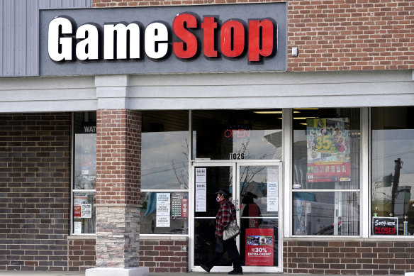 GameStop shares have tumbled after new restrictions were placed by online brokerages.