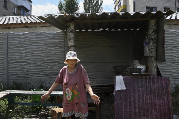 Lysychansk resident Lidia Bezaltysha cooks whatever she is given over a wood fire outside her home. 