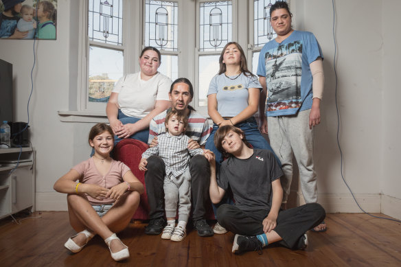 Single father David Glenny with his family, Satine, 21, Celeste, 15, Satine’s partner Chaze, (back row); and Uraia, 12, Satine’s child Reimana, 3, and Addicus, 13, in their Maribyrnong home.
