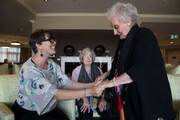Kiama's council-run nursing home, Blue Haven, has fewer residents than most, with residents clustered around a central hub.  Photo shows Dr Louisa Smith from the University of Wollongong who has been leading a project to help aged care workers connect with residents at Blue Haven Care including (L-R) Mavis Cummins  and Margaret Murphy. 
