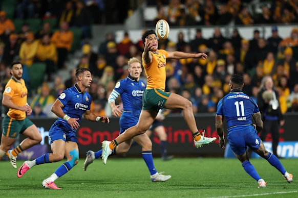 Joseph-Aukuso Suaalii of the Wallabies leaps for the ball.