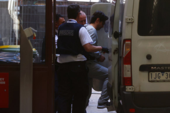 Luay Sako is escorted out to the prisoners’ van at the Supreme Court of Victoria on Monday.