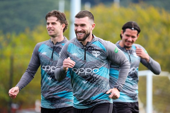 Tim Payne (centre) has become the talk of the football world - specifically because nobody knew much about him.