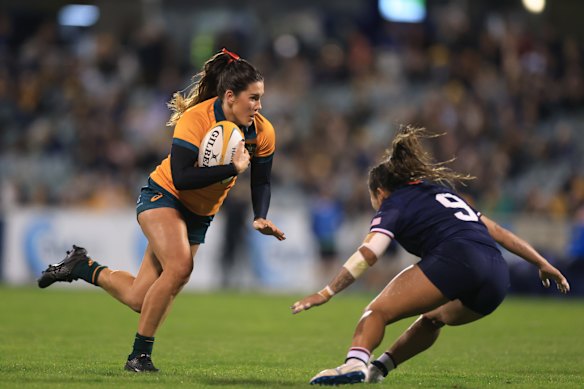 Charlotte Caslick of the Wallaroos runs the ball during the Pacific Four Series International Match between Australia Wallaroos and USA.