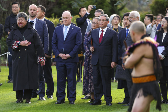 New Zealand Prime Minister Christopher Luxon looks on while Chinese Premier Li Qiang is welcomed with a pōwhiri during an official welcome at Government House.