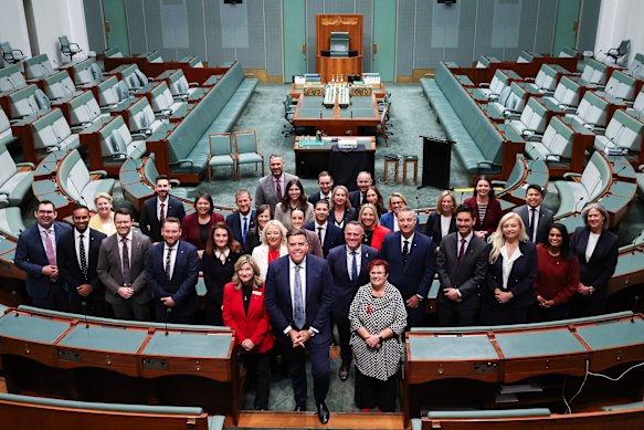 Speaker Milton Dick (centre) poses with newly elected members of the House of Representatives yesterday.