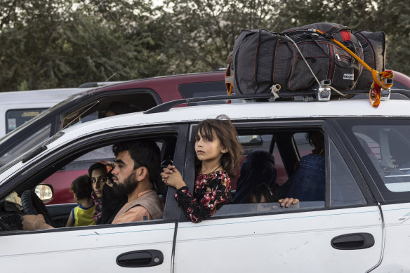 An Afghan family flee their home in the northern province as the Taliban pushed towards Kabul.