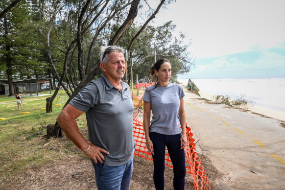 Rodney Gibbons and Christine Luke inspect the damage along the Gold Coast foreshore.