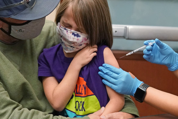 A 7 year old in the US state of Utah gets vaccinated.  Vaccination of children under 12 is yet to be approved in Australia.