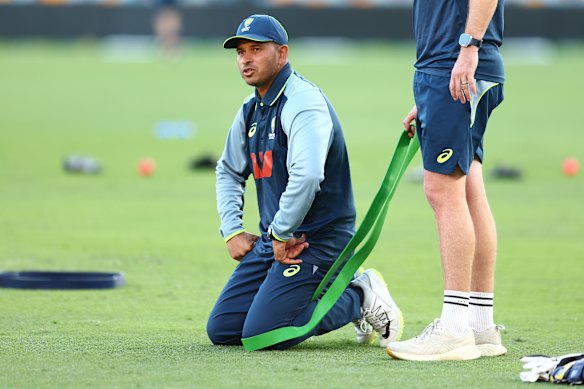 Khawaja stretches during an Australian training session.