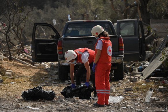 Red Cross members recover the remains of a baby at the site of the strike in the village of Aitou in northern Lebanon.