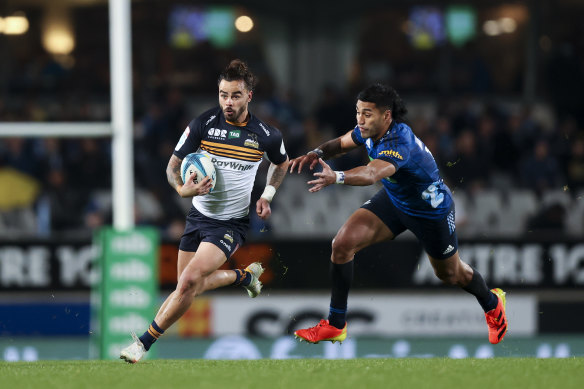 Andy Muirhead breaks away from Rieko Ioane during the Brumbies’ narrow Super Rugby semi-final loss to the Blues last week.