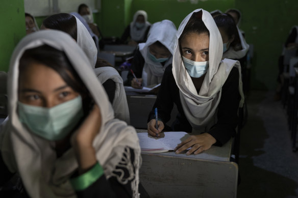 Female students in class prior to the Taliban seizing power last year. 