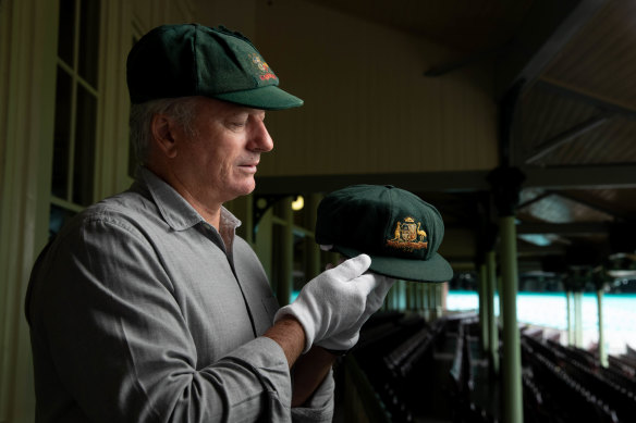 Steve Waugh wearing his cap and holding Don Bradman’s at the Sydney Cricket Ground.