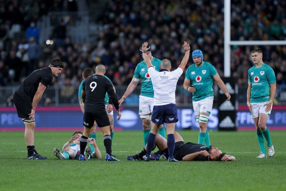 Ireland’s Garry Ringrose and New Zealand’s Angus Ta’avao on the ground after a head-on-head collision.