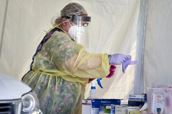 A nurse prepares to administer a coronavirus test in Nebraska this week.
