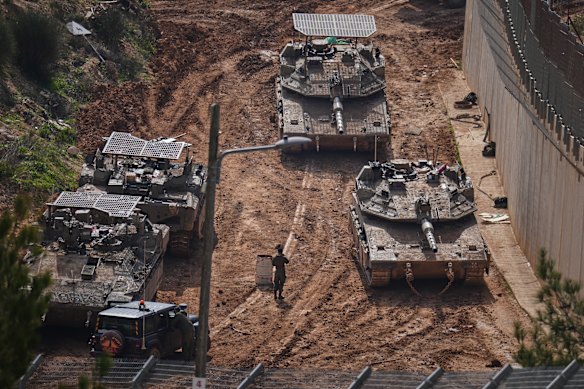 Israeli tanks manoeuvre near the Israel-Lebanon border.