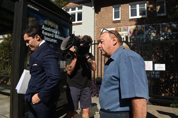 Phillip Hanslow leaving Waverley Local Court with his lawyer Bryan Wrench (left) on Thursday. 