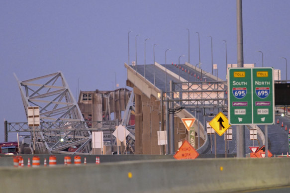 Parts of the Francis Scott Key Bridge remain after a container ship collided with a support.