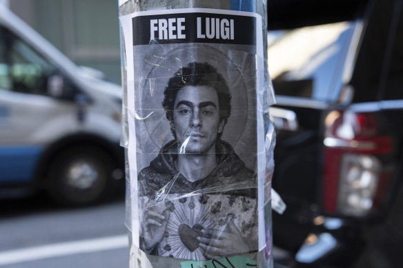 A poster depicting Mangione outside the Hilton Midtown Hotel in New York.