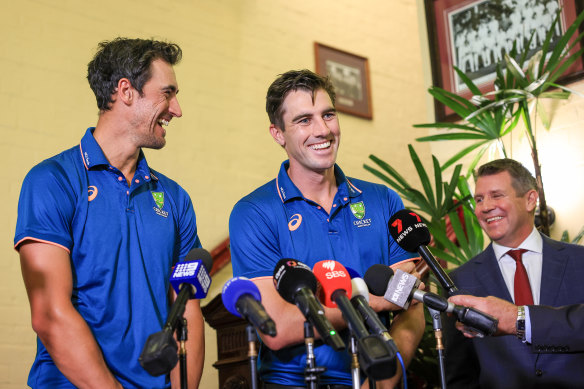 Mitchell Starc and Pat Cummins with Mike Baird.