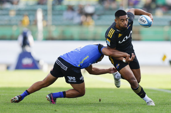 Salesi Rayasi of the Hurricanes is tackled during the round 6 match.