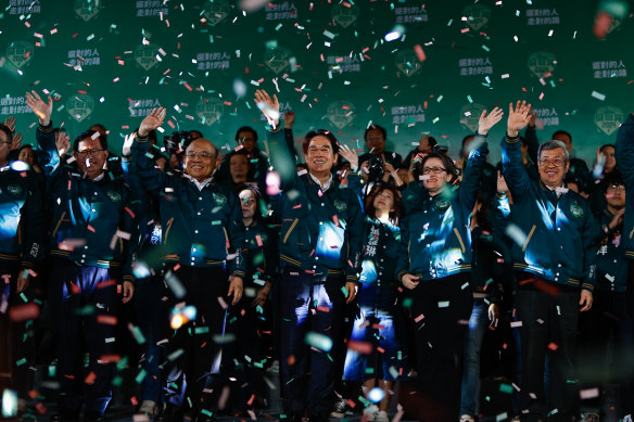Taiwan’s President-elect Lai Ching-te celebrates after winning the vote on Saturday night. 