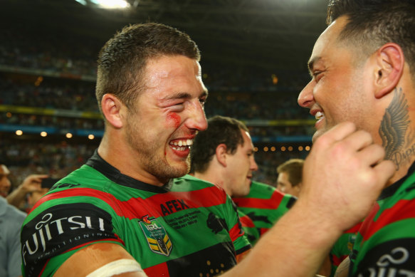 Sam Burgess and John Sutton celebrate South Sydney’s drought-breaking premiership in 2014.