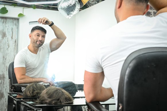 Mark Twiname, founder of Mane, a hair replacement system studio in Melbourne, also wears a hair piece.